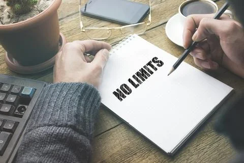 Man written no limits text on notepad Stock Photos