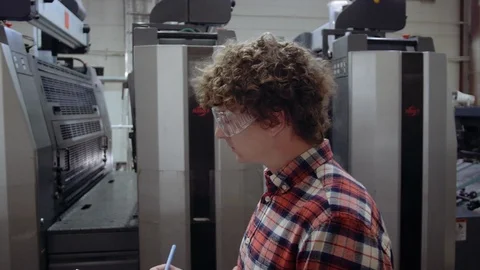 Man writting with pen in tablet at work. Closeup portrait of young coworker in Stock Footage 110796386