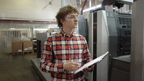 Man writting with pen in tablet at work. Closeup portrait of young coworker in Stock Footage 110796576