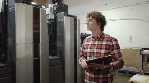 Man writting with pen in tablet at work. Closeup portrait of young coworker in Stock Footage 110796651