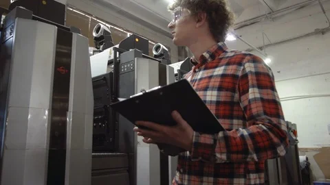 Man writting with pen in tablet at work. Closeup portrait of young coworker in Stock Footage 110796803