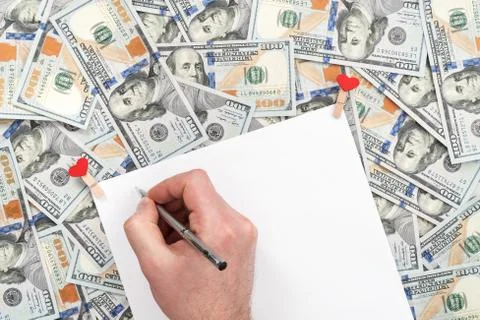 Man wrote a letter on dollars Stock Photos
