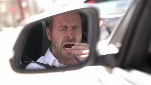 Man yawn in his car because is so tired Stock-Footage 143385924
