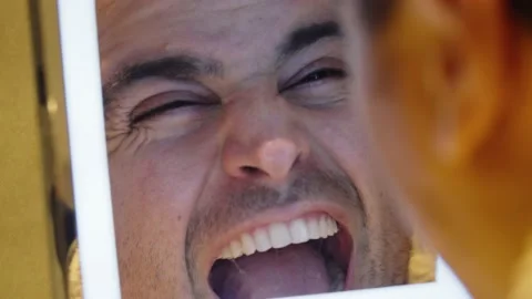 Man yelling in mirror Stock Footage 168477508