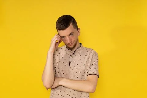 The man on the yellow background is sad Stock Photos