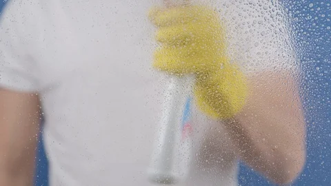 A man in yellow gloves washes a window. Stock Footage 129248825