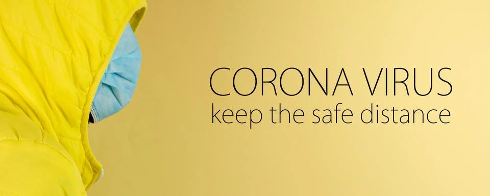 Man in yellow jacket is using a protective mask against corona virus on yello Stock Photos