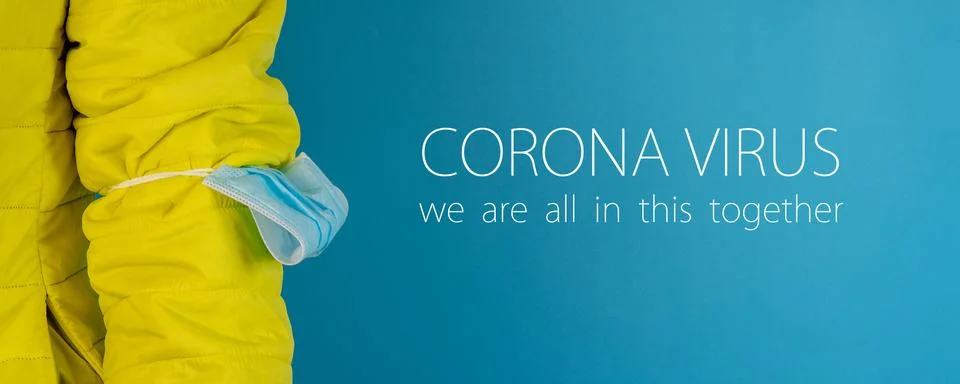 Man in yellow jacket is using a protective mask against corona virus on blue  Stock Photos