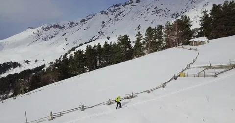 A man in yellow is rising in the mountains Video stock 85086396