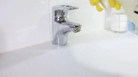 Man in Yellow Rubber Gloves Cleans the Bathroom Sink. Stock Footage 153536816