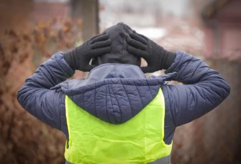Man in a yellow vest protesting Stock Photos