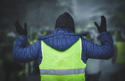 Man in a yellow vest protesting Stock Photos