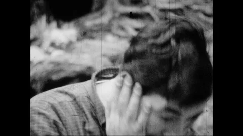 Man yells in panic and grief by river Stock Footage 109558495