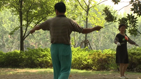 Man with yo-yo in park Stock Footage 37702509