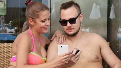 Man young lovers do selfi wife by the pool on vacation Stock Footage 53772704