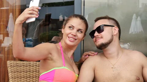 Man young lovers do selfi wife by the pool on vacation Stock Footage 53772847