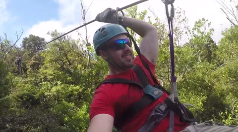 Man ziplines angled view Stock Footage 63503241