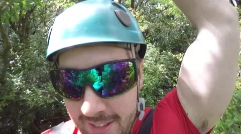 Man ziplines front view Stock Footage 63504459