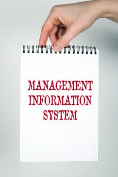 MANAGEMENT INFORMATION SYSTEM concept. Note book with text Stock Photos