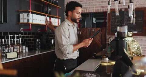 Management, planning and tablet with man in coffee shop for agenda or online Stock Footage 330076936