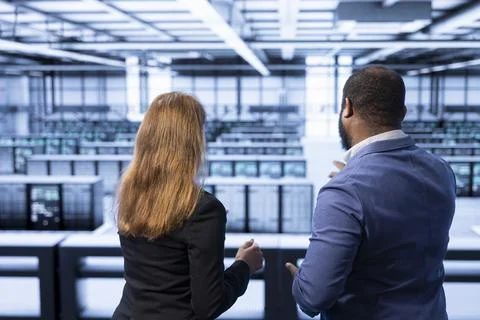 Management team overseeing data center Foto stock