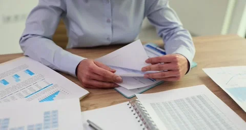Manager accountant leafing through documents closeup Video stock 265162026