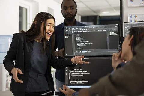 Manager Addressing Delays in Web Development Project 스톡 사진