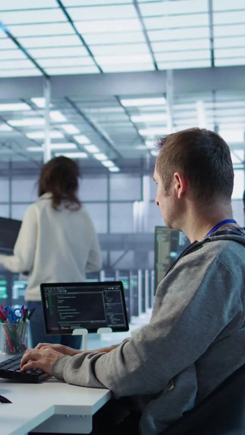 Manager admonishing programmer after making error in data center Stock Footage 319576178