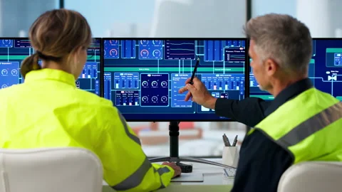 Manager And Engineer Discuss SCADA System Controls. Stock Footage 335877767