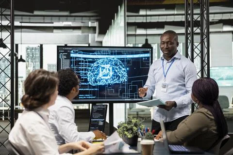 Manager and IT employees collaborate on implementation of AI solutions Foto stock