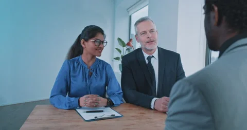 Manager and recruiter asking questions to possible candidate Stock Footage 208046801