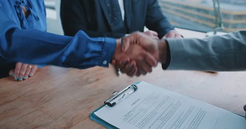Manager and recruiter shaking hands with candidate Stock Footage 208045904
