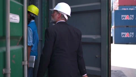 Manager and staff survey load container for shipping plan in Logistic company. Stock Footage 233282100