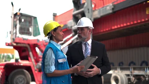 Manager and staff survey load container for shipping plan in Logistic company. Stock Footage 233282300