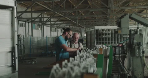 The manager and technological engineer check plastic window frame with calipers Stock Footage 130562326