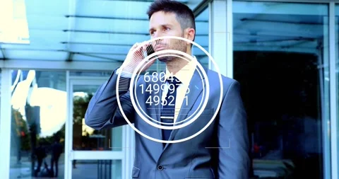 Manager answering phone outside office, making business call while HUD on torso Stock Footage 333833607