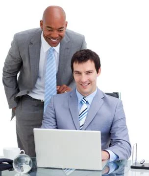 Manager assisting his colleague at a computer Stock Photos
