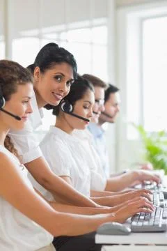 Manager assisting staffs in call center Stock Photos