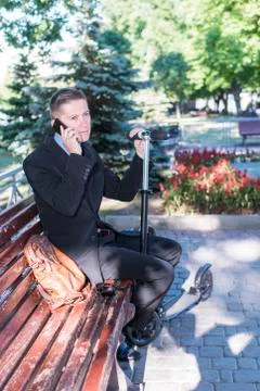 Manager on the bench with phone Stock Photos