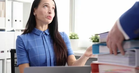 Manager brought employee large stack of folders to work with 4k movie Video stock 255636436