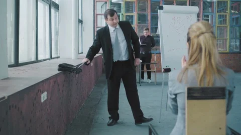 Manager in a business suit completed the presentation. The audience accompanies Stock Footage 108035499