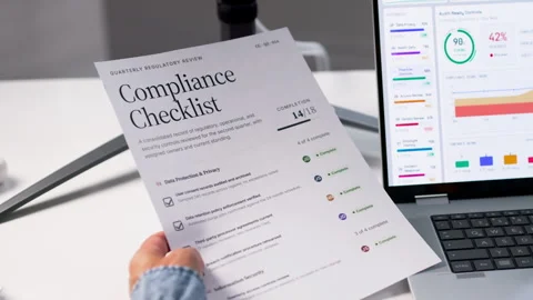 Manager Carefully Checking Compliance Checklist Document At Office Desk Stock Footage 336794223