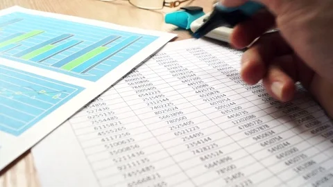 Manager checking financial report and work with papers. Stock Footage 78751446