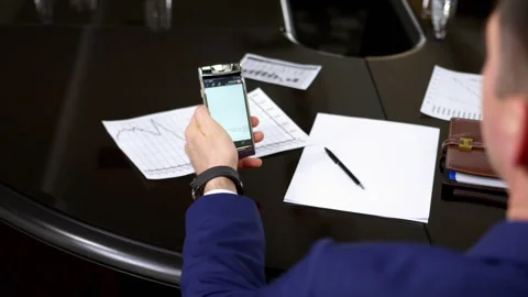 Manager checks received message and stands up from chair Stock Footage 244910652