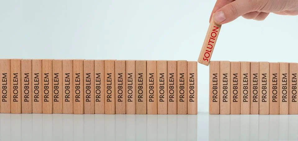 Manager chooses solution labeled block from wooden cubes that says problem Stock Photos