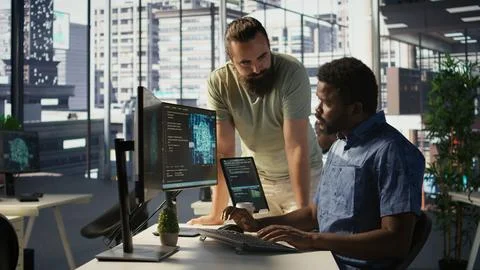 Manager coming to check on progress done by programmer creating AI Stock Photos