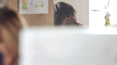 The Manager communicates by phone with the client in the office Video stock 98303664