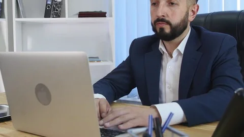 Manager of the company texting in the office Stock Footage 75891921