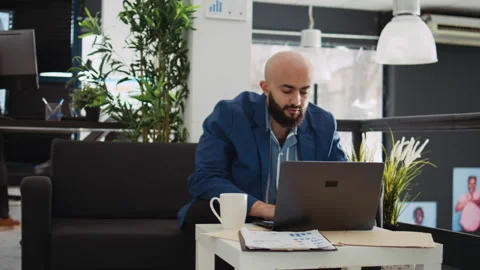 Manager comparing data on laptop Stock Footage 244270086