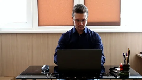 Manager at the computer. Businessman working with laptop Stock Footage 87699499